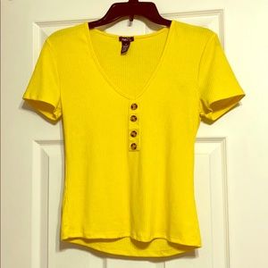 A lightweight yellow Rue21 short-sleeve shirt